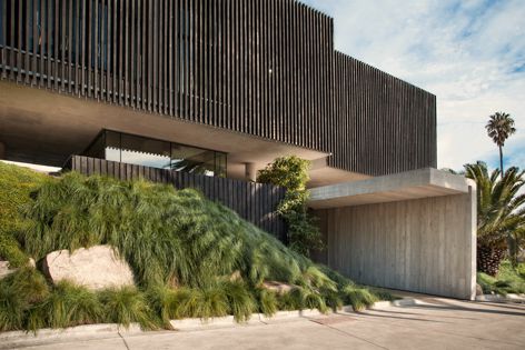 The Green Star-rated rebuild of the Stokehouse In Melbourne features a textured off-form finish.