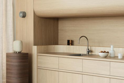 The cabinetry and benchtop are Laminex Aged Ash in Chalk finish. The splashback and drawer interiors are Laminex Milkwood.
