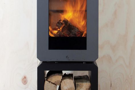 The Andor freestanding wood heater features clean lines and subtle curves designed to highlight the flame patterns within the combustion chamber.